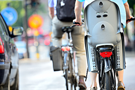 Rear view of bicyclist with child chairの写真素材