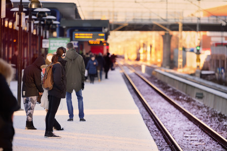 People waiting for the train, winter platformの写真素材