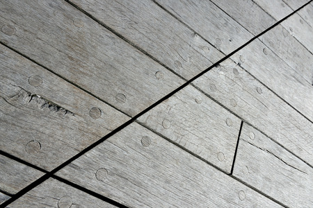 Abstract wooden background with wooden nailsの写真素材