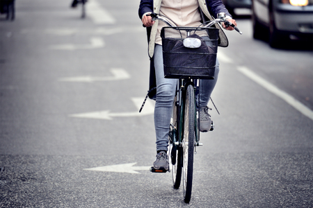 Female bicyclist on the streetの写真素材