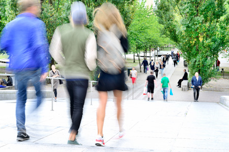 Motion blurred pedestrians in stairs in parkの写真素材