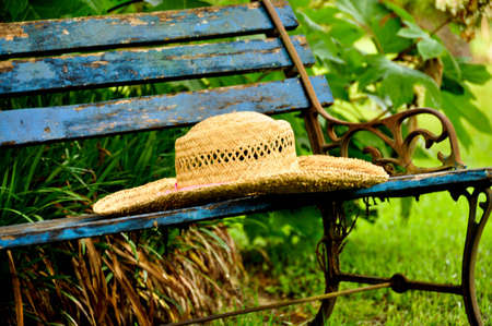 Straw Hat on Benchの写真素材