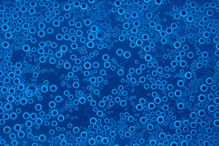 Background of bubbles of sparkling water in blue light