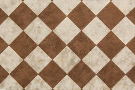 Background of old chessboard and checkers on a diagonalの写真素材