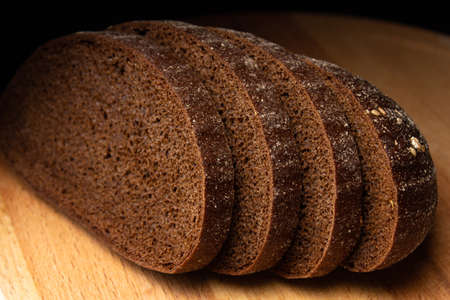 Sliced â€‹â€‹black bread on a wooden board