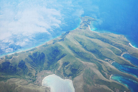 Aerial view of Komodo islands, Indonesia, surrounded by deep blue watersの写真素材