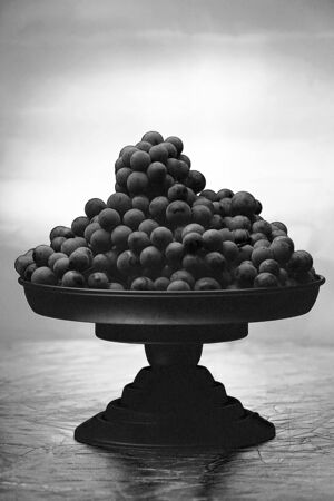 a lot of grapes in black and white color with lighten backgroundの写真素材