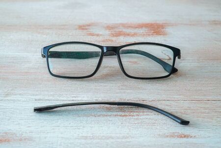 black glasses with sad faceの写真素材