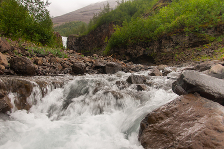 A natural rocky river stream in Taimyr at the Far North of Russiaの写真素材