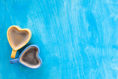 Heart cup on a blue background, coffee on valentine's day, love conceptの写真素材