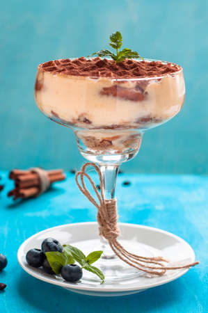 luxurious dessert Tiramisu in a glass decorated with mintの写真素材