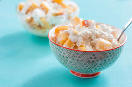 breakfast cottage cheese with peach sour cream and honeyの写真素材