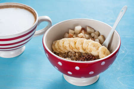 Healthy breakfast, oatmeal, banana, pear, honey, flax seeds, chia seedsの写真素材