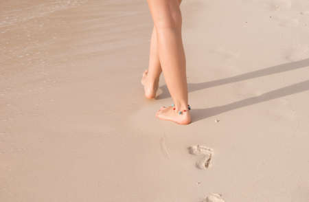 Feet, walk along the shore, feetの写真素材