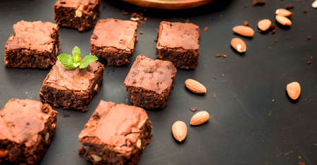 homemade chocolate brownies on dark background, top viewの写真素材