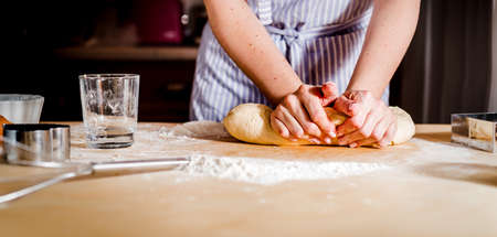 Female hands making dough for pizza kitchen accessories