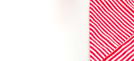 Red textile, napkin, tablecloth on wooden kitchen table. View from above, top with copy space. Traditional pattern and color.の写真素材