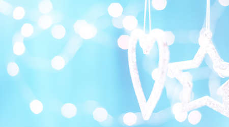 Christmas card with Christmas decorations on a sparkling blue backgroundの写真素材