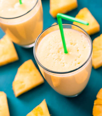 Sliced pineapple with a glass of pineapple juiceの写真素材