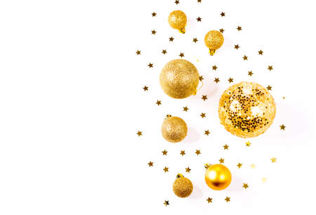 Christmas composition. a pattern of golden christmas balls and stars from above. Flat lay, top viewの写真素材