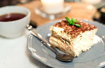 Italian tiramisu dessert tiramisu dessert on a porcelain plateの写真素材