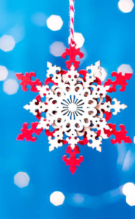 Christmas star made of wood with ropeon a sparkling blue backgroundの写真素材