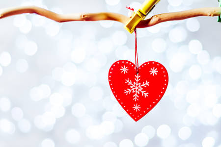 wooden heart sign with rope isolated on white backgroundの写真素材