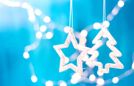 Christmas card with Christmas decorations on sparkling blue background