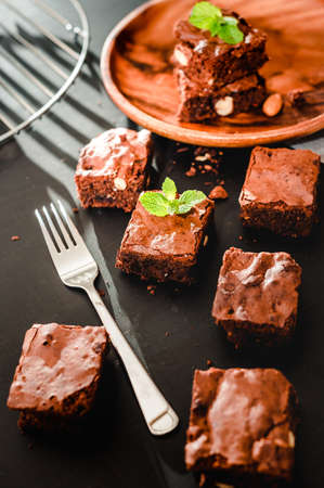 Homemade chocolate brownies on wooden background closeup, top viewの写真素材