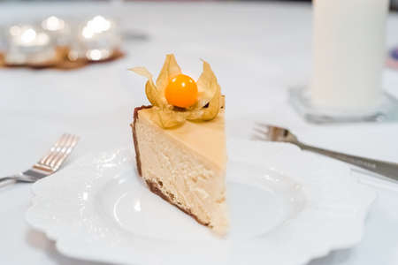 Slice of new york style cheesecake with winter cherry