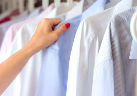 ironed shirts in the closet, selection