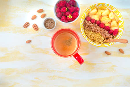 gorgeous healthy breakfast, oatmeal porridge with flax seeds, raspberries and nuts.の写真素材