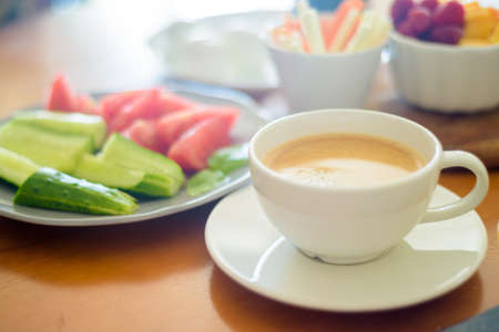 Breakfast with coffee, egg, vegetables and fruitsの写真素材