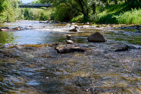 Dreisam in Freiburg in spring, River in the city of Freiburg, Germany, stonesの写真素材