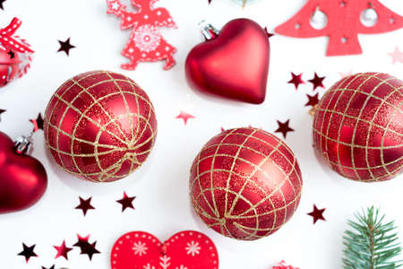 Frame made of Christmas decoration with christmas glass balls, tinsel, bow.