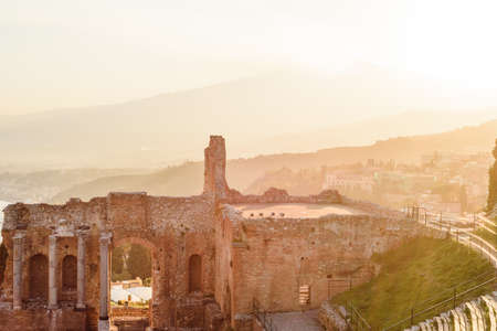 Greek reatre in Taormina Sicily, Italy, and Etna volcano in the backgroundの写真素材