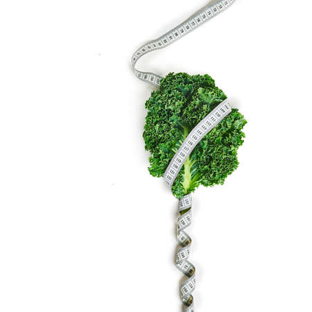Kale with measuring tape concept diet