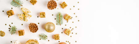 Christmas composition. Christmas balls, golden decorations on white background. Flat lay, top view,...