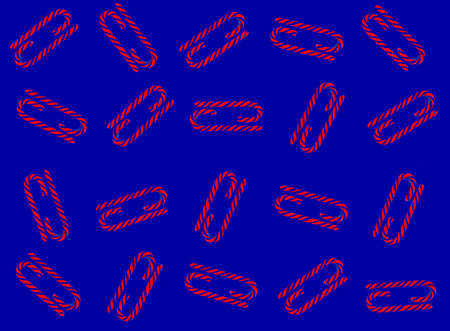 Christmas candy cane pattern on blue blue background. Flat lay