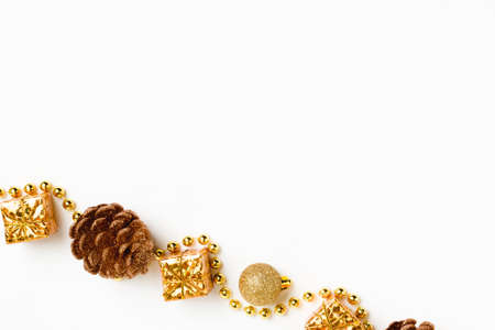 Christmas ornament of gold color, on a white background, top view