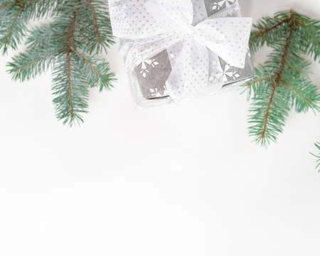 Christmas gift box with festive decoration in silver tone