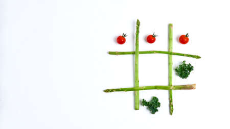 tic tac toe with food, asparagus kale, tomato, concept slimming, decision, choice victoryの写真素材