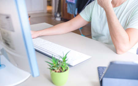 Man working at home on laptop computer