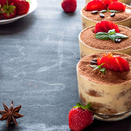 Strawberry dessert tiramisu on a brown backgroundの写真素材