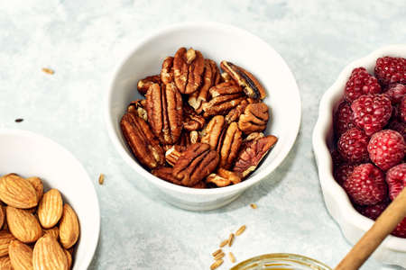 Peeled pecan nuts isolated on white backgroundの写真素材