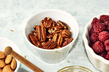 Peeled pecan nuts isolated on white backgroundの写真素材