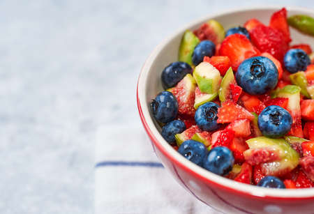 fig strawberry blueberry fruit salad, concept diet and healthy eatingの写真素材
