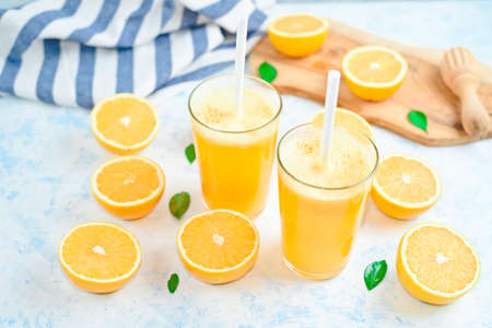 orange juice in a glass, top view, slices of oranges, strawの写真素材