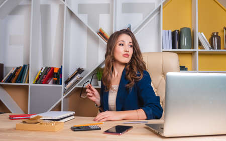 serious business lady is thinking about solving a business problemの写真素材