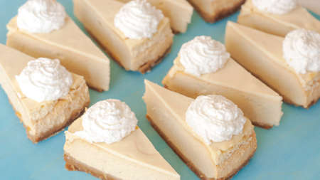 cheesecake pattern, servings of cheesecake on a blue background top viewの写真素材